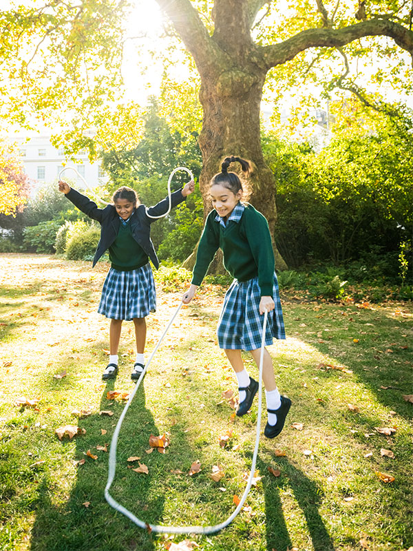 Girls Skipping outdoors